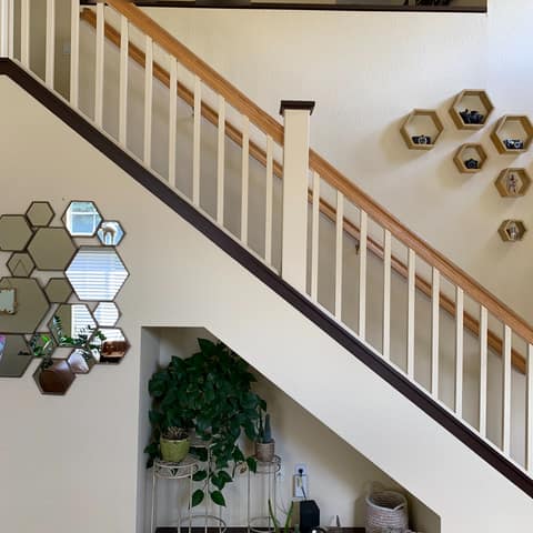 Before: the original wood and white spindle stair railing.