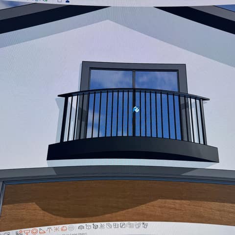 3D design model of a curved steel balcony with round pickets, drawn before fabrication.